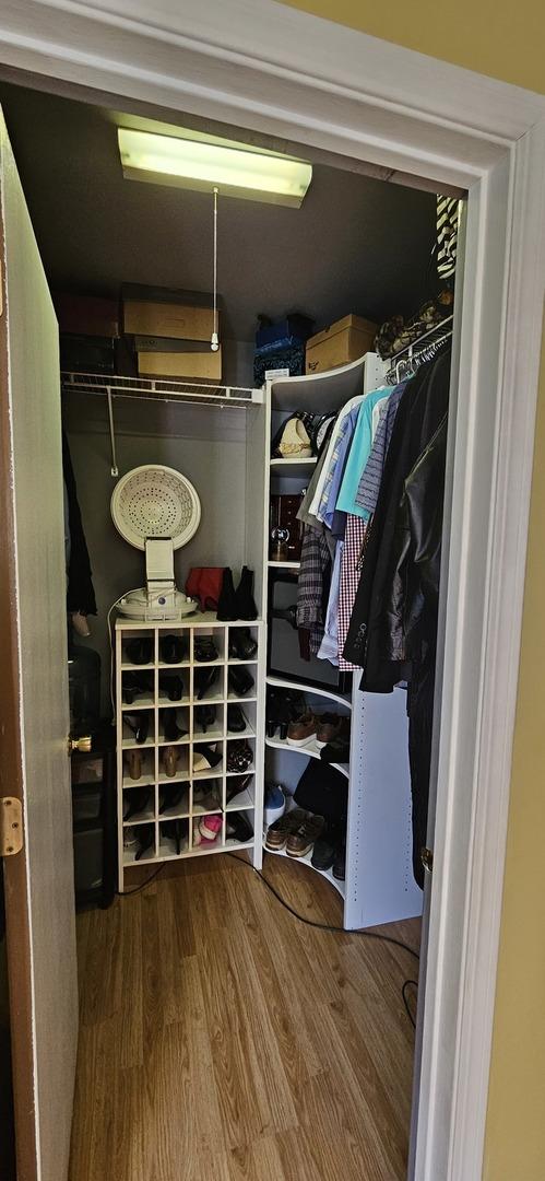 spacious closet featuring wood finished floors