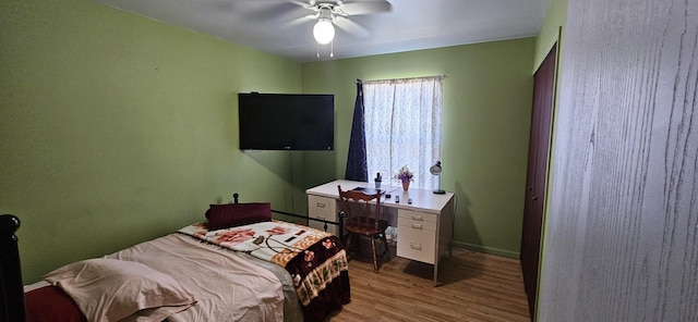 bedroom with wood finished floors and a ceiling fan