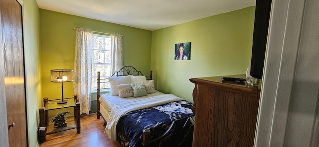 bedroom featuring wood finished floors