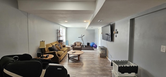 living room with recessed lighting and wood finished floors