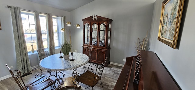 dining room with wood finished floors and baseboards