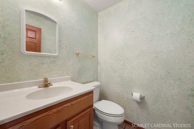 bathroom featuring vanity and toilet