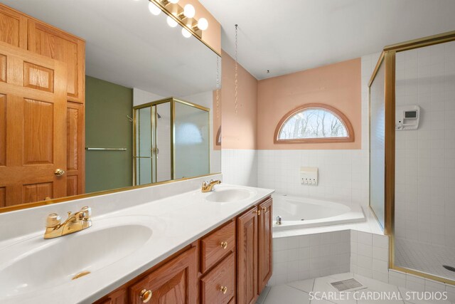 bathroom featuring vanity and plus walk in shower