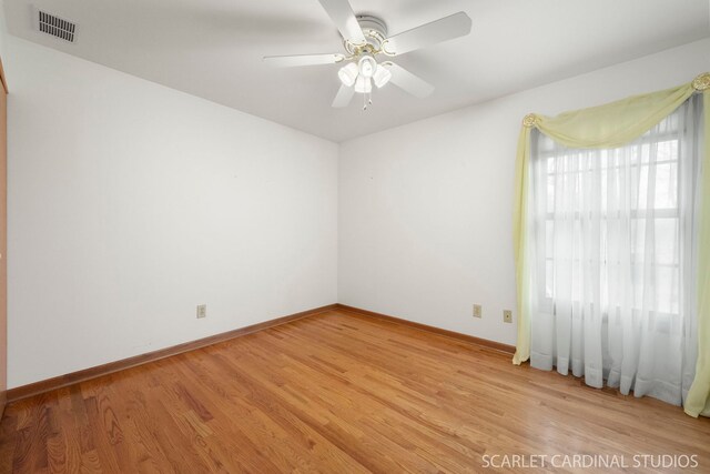 unfurnished room featuring ceiling fan and light hardwood / wood-style flooring