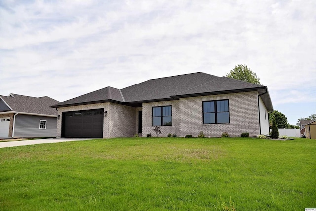 2500 Taylor Dr, Quincy, IL 62305 - view of front facade with an attached garage, a front yard, brick siding, driveway, and a shingled roof