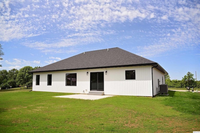 2500 Taylor Dr, Quincy, IL 62305 - back of house featuring central air condition unit, a lawn, a patio area, and roof with shingles
