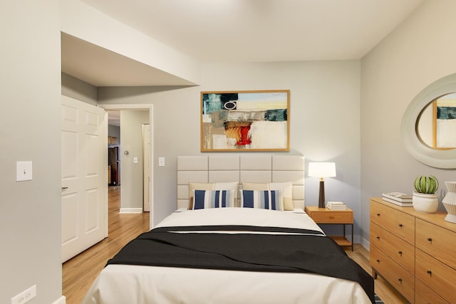 bedroom with light hardwood / wood-style flooring