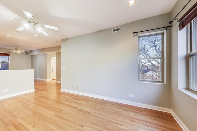 spare room featuring ceiling fan and light wood-type flooring