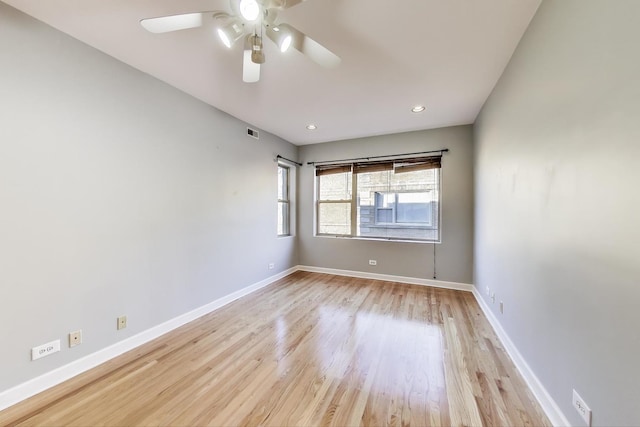 empty room with light hardwood / wood-style flooring and ceiling fan