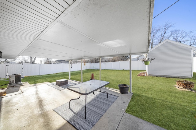 view of patio with central AC and an outdoor fire pit