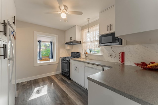 kitchen featuring pendant lighting, tasteful backsplash, white cabinets, dark hardwood / wood-style flooring, and white appliances