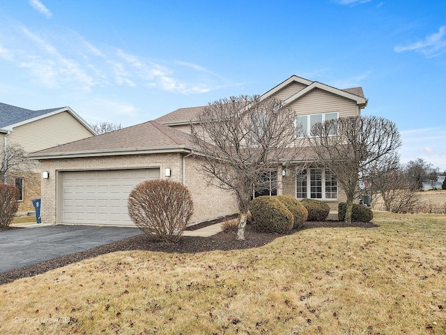 front of property with a garage and a front lawn