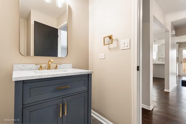 bathroom featuring vanity and hardwood / wood-style flooring