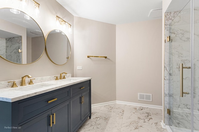 bathroom with vanity and a shower with door