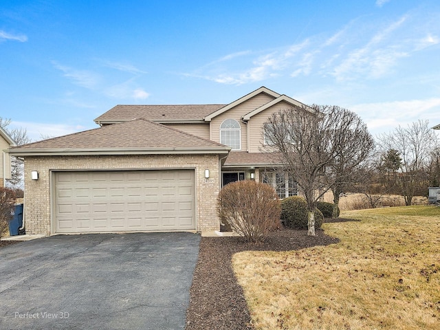 view of front property with a garage and a front yard