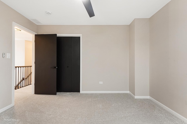 spare room featuring light colored carpet