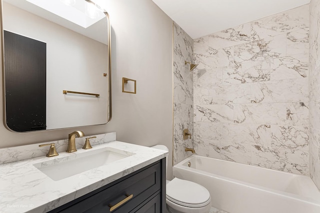 full bathroom with tiled shower / bath combo, vanity, and toilet