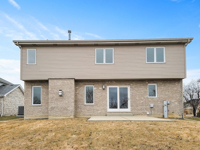 back of house with a yard and a patio area