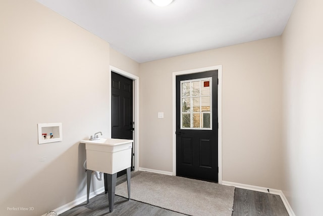 washroom with washer hookup and wood-type flooring