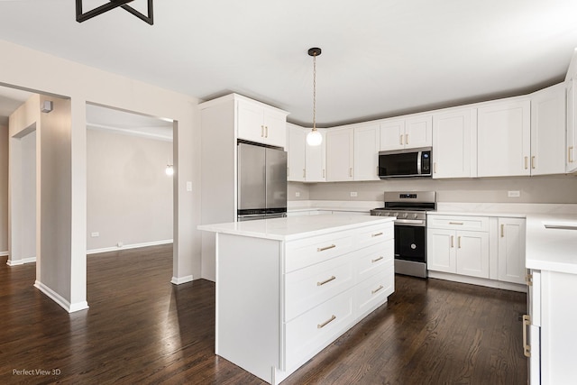 kitchen with a kitchen island, pendant lighting, white cabinets, dark hardwood / wood-style flooring, and stainless steel appliances