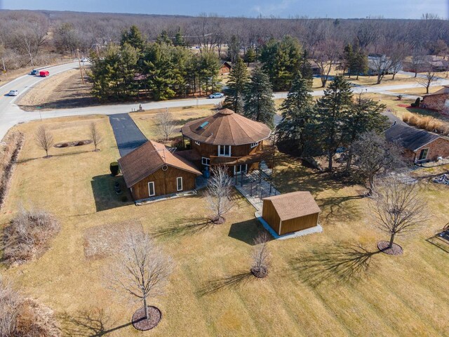 view of front of house with a wooden deck and a front yard