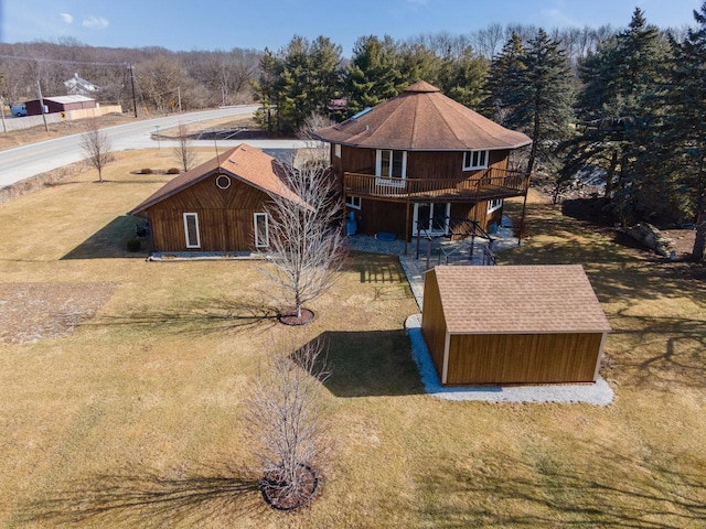 view of front facade featuring a front yard and a deck