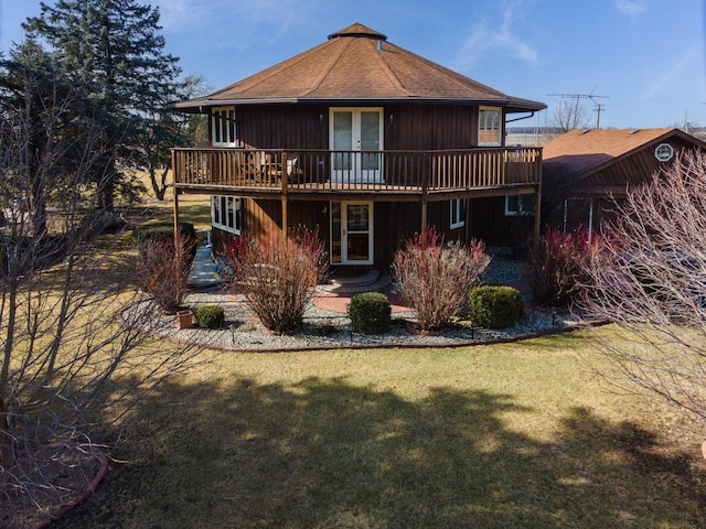 back of house featuring a yard and a deck