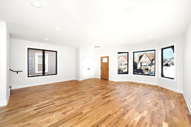 unfurnished room with light hardwood / wood-style floors