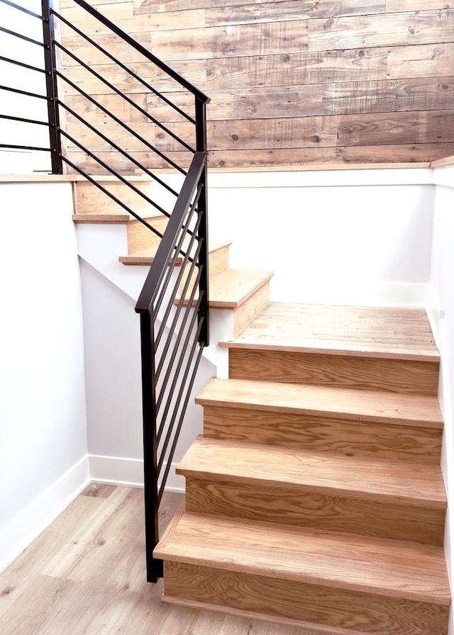 staircase featuring hardwood / wood-style flooring