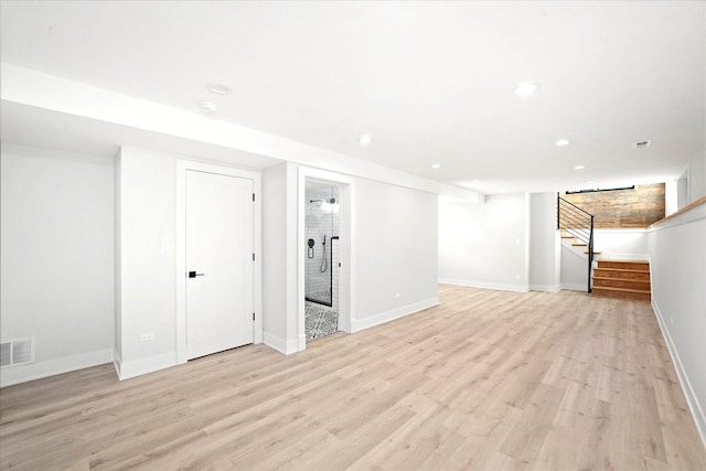 basement featuring light wood-type flooring