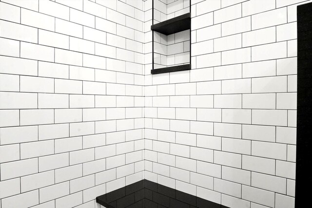 bathroom with a tile shower