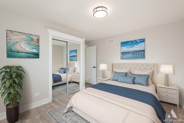 bedroom with a closet and light wood-type flooring