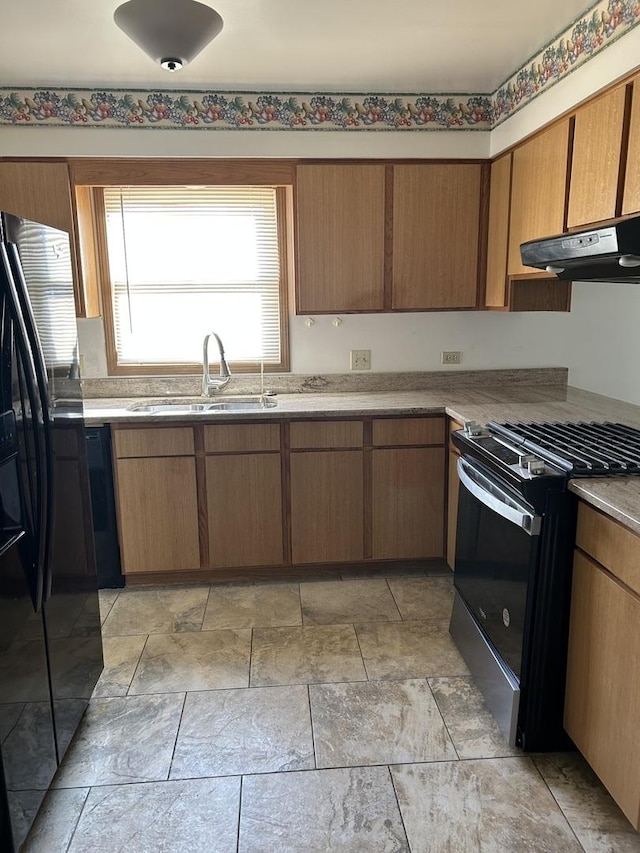 kitchen with sink and black appliances