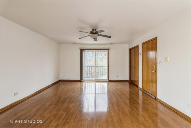 spare room with ceiling fan and wood-type flooring