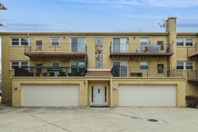 multi unit property featuring a garage