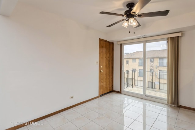 tiled spare room with ceiling fan