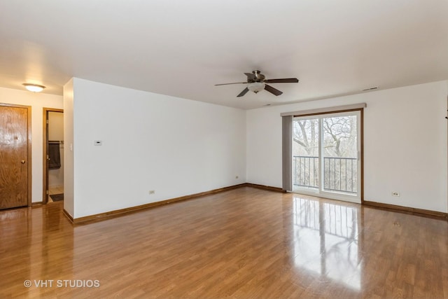 empty room featuring ceiling fan and light hardwood / wood-style floors