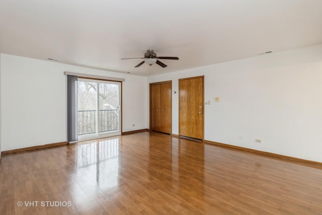 unfurnished room with ceiling fan and light wood-type flooring