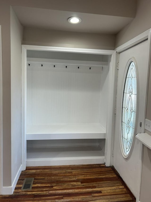 mudroom with dark hardwood / wood-style floors