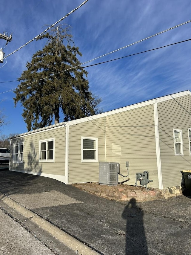 view of home's exterior featuring central AC unit