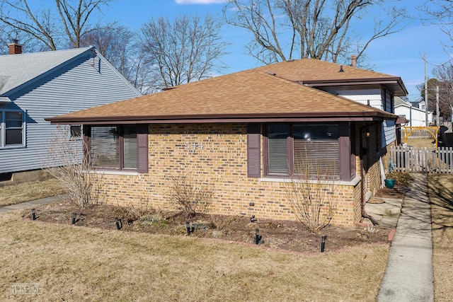 view of side of property featuring a yard