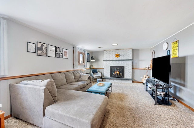 carpeted living room featuring a brick fireplace