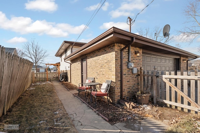 view of side of property with a garage