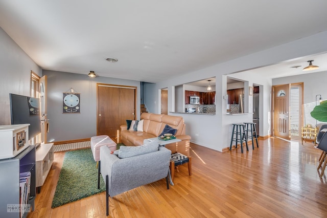 living room featuring light wood-type flooring