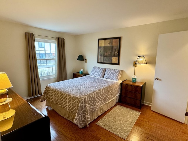 bedroom with hardwood / wood-style flooring