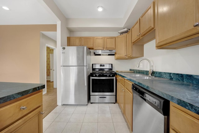 kitchen featuring appliances with stainless steel finishes, sink, light brown cabinets, and light tile patterned floors