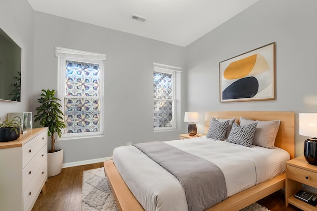 bedroom featuring dark wood-type flooring