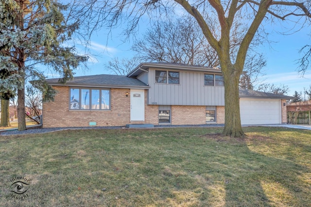 split level home featuring a garage and a front yard