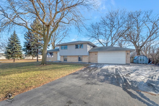 view of front facade with a garage and a front yard