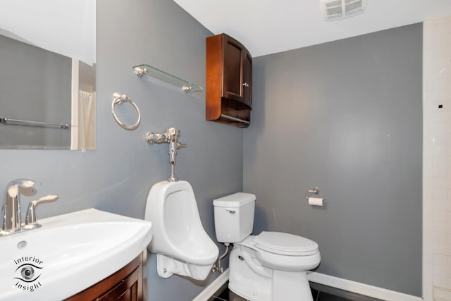 bathroom featuring sink and toilet